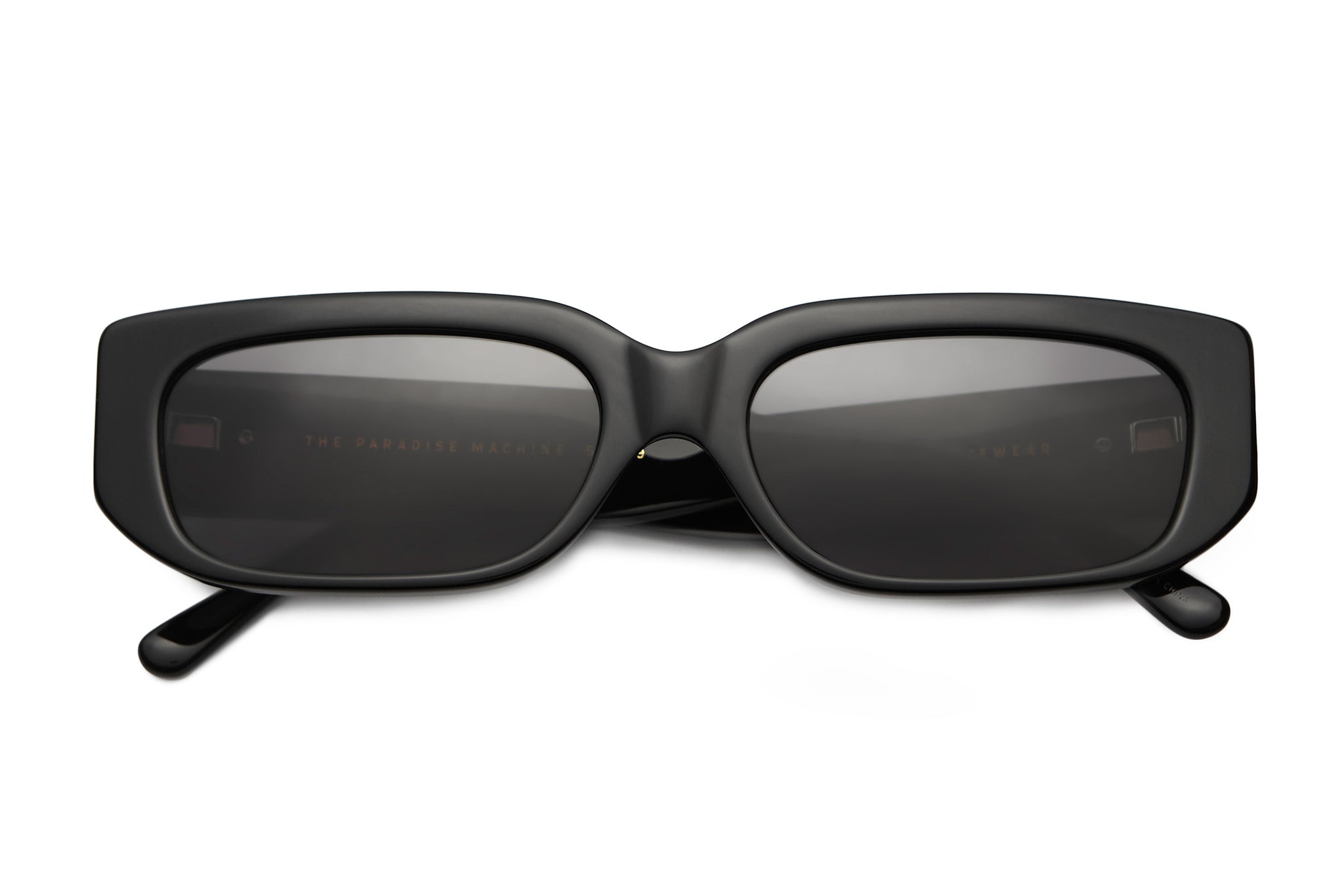 https://www.crapeyewear.com/cdn/shop/products/Crap_Eyewear-The_Paradise_Machine-Black_Acetate_Skinny_Thin_Square_Sunglasses-Grey_Lens-front2_2048x.jpg?v=1683588634